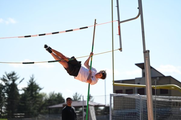 Michael Huber ‘26 flinging himself up 10 feet during pole vaulting practice.