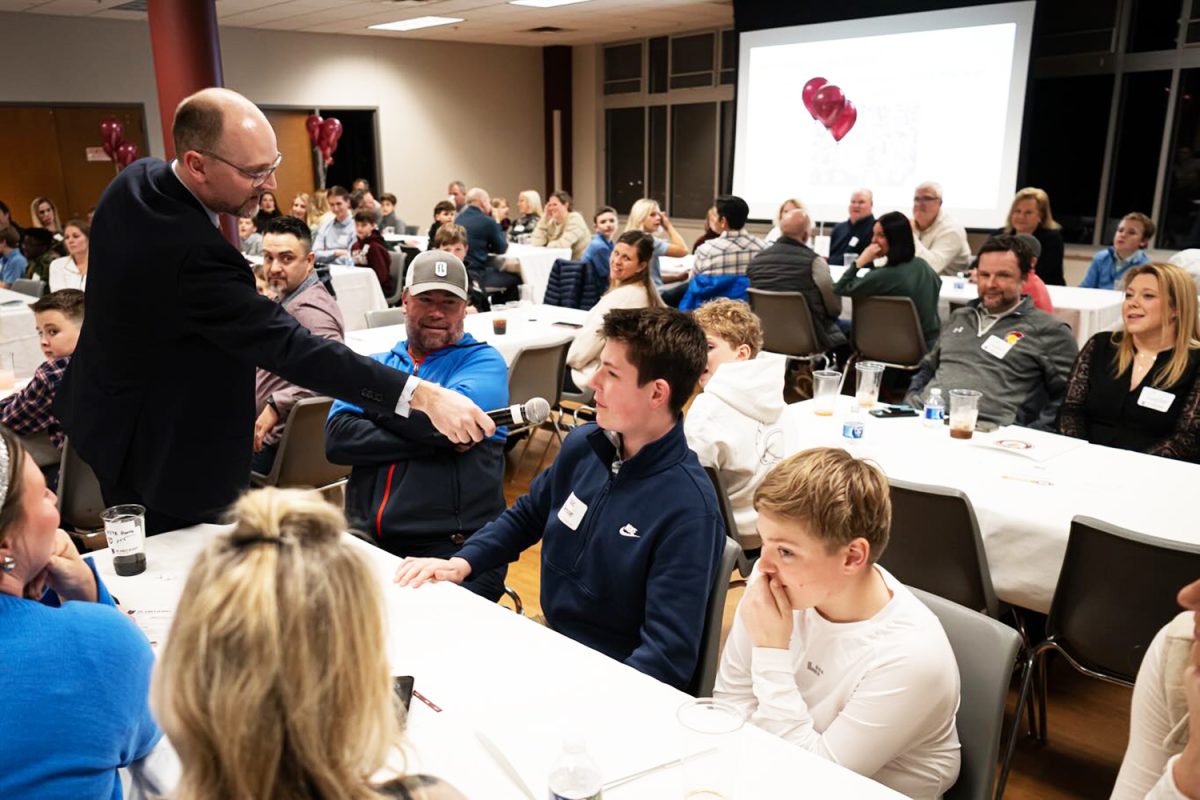 A future middle school student speaks into the microphone during the Middle School Welcome Night on March 4, 2025.