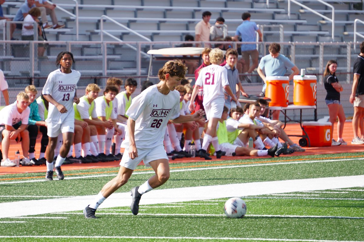 Caden Fleming drives the ball down the field during the Soccer Jamboree on Friday, August 22.