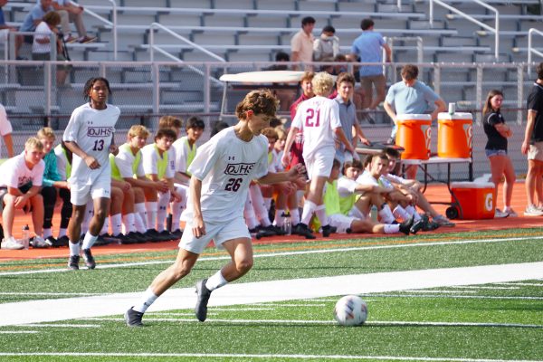 Caden Fleming drives the ball down the field during the Soccer Jamboree on Friday, August 22.