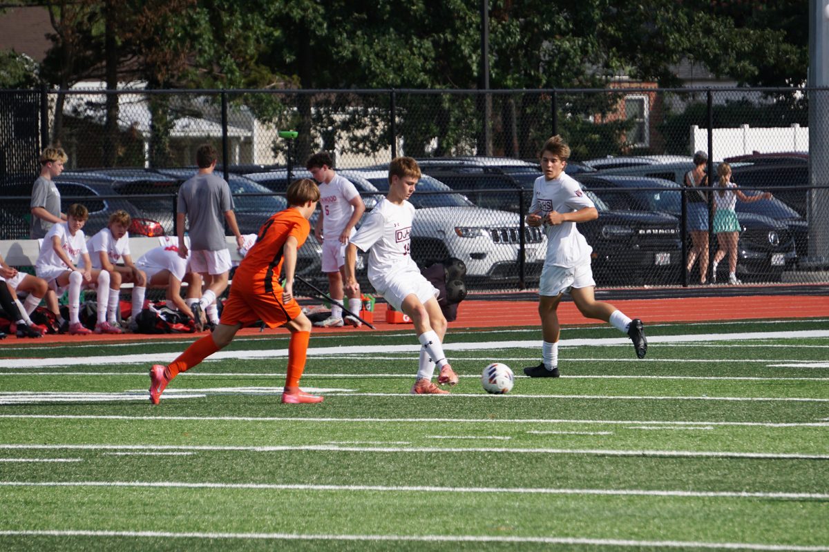 A soccer player passes to a teammate during the Soccer Jamboree on Friday, August 22.