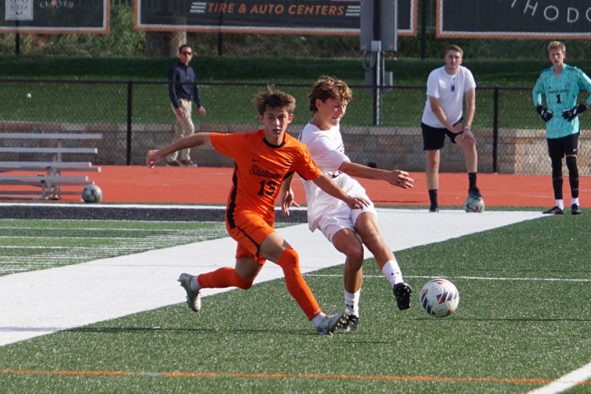 A Spartan weaves through defenders at the Soccer Jamboree on Friday, August 22.