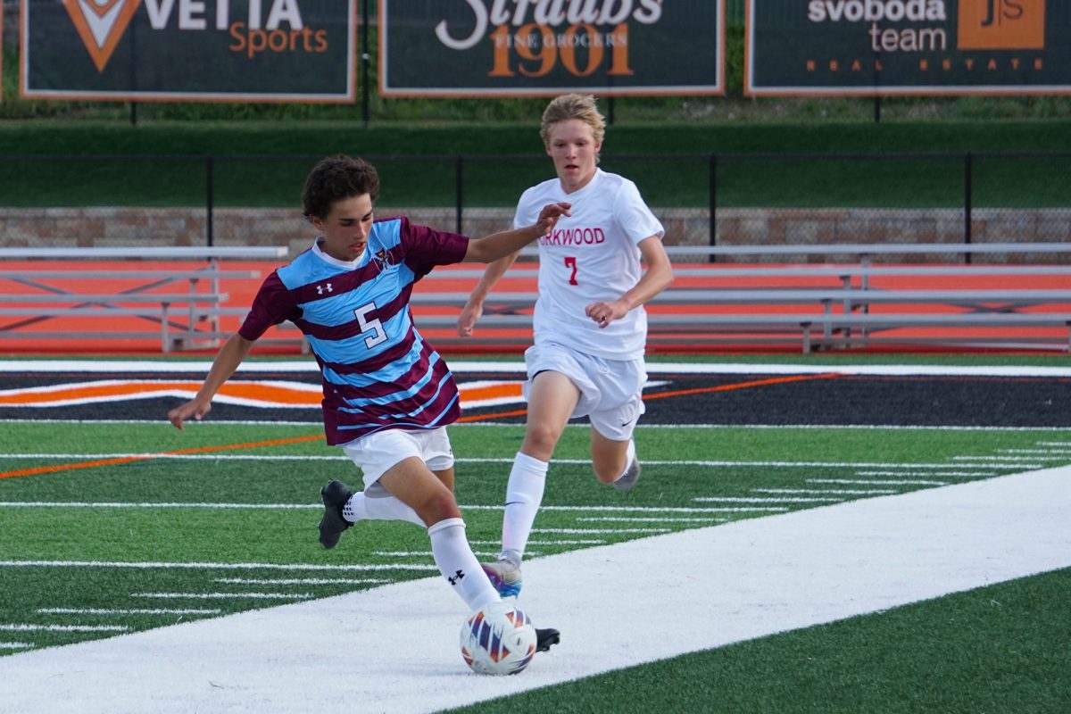 Zach Costello dribbles past a defender during the Soccer Jamboree on Friday, August 22.