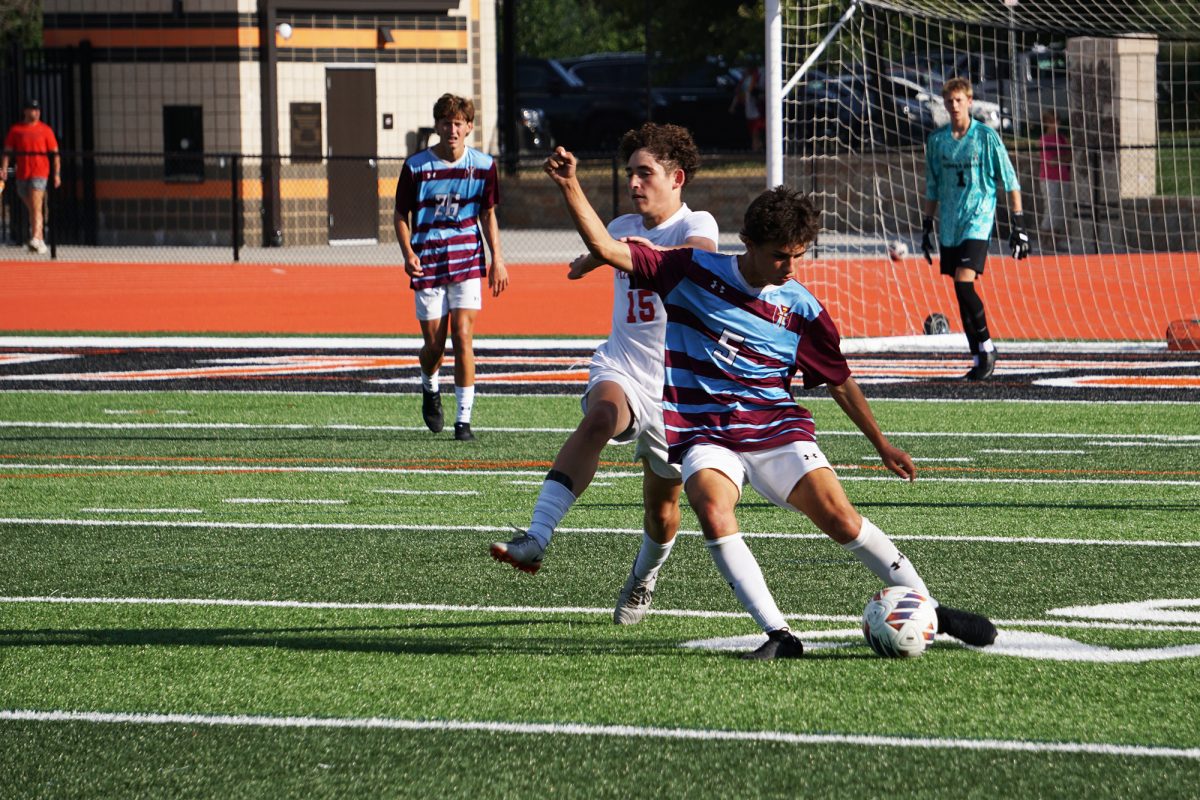Zach Costello dribbles past a defender during the Soccer Jamboree on Friday, August 22.