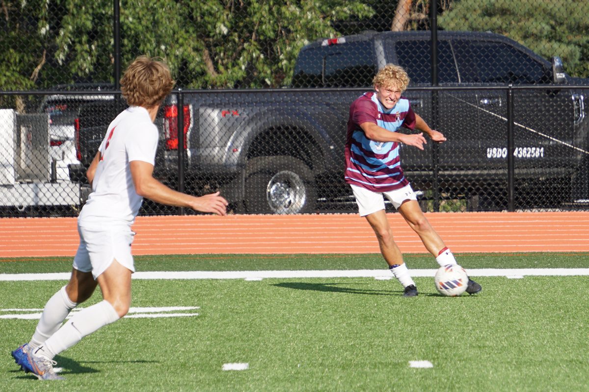 Ricky Barnes dribbles past a defender during the Soccer Jamboree on Friday, August 22.