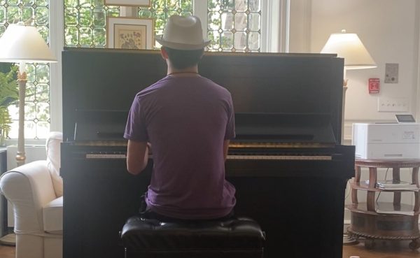 Austin Spinner '28 playing at his home piano.