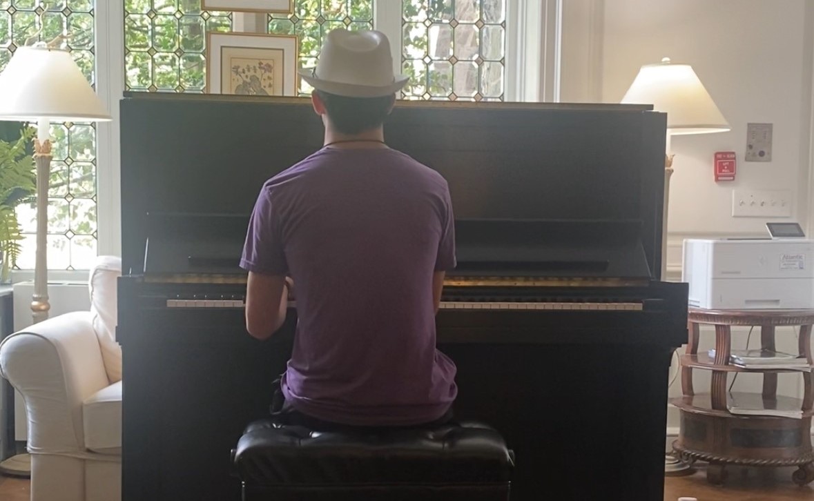Austin Spinner '28 playing at his home piano.