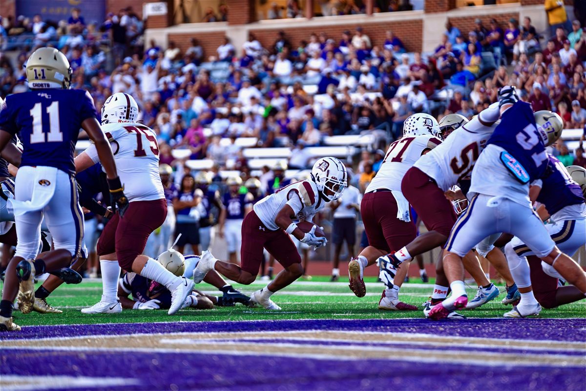 Football player stumbles into the in-zone for a touchdown at the Varsity Football game vs CBC. Photo taken by Jack Gaffney ‘26.