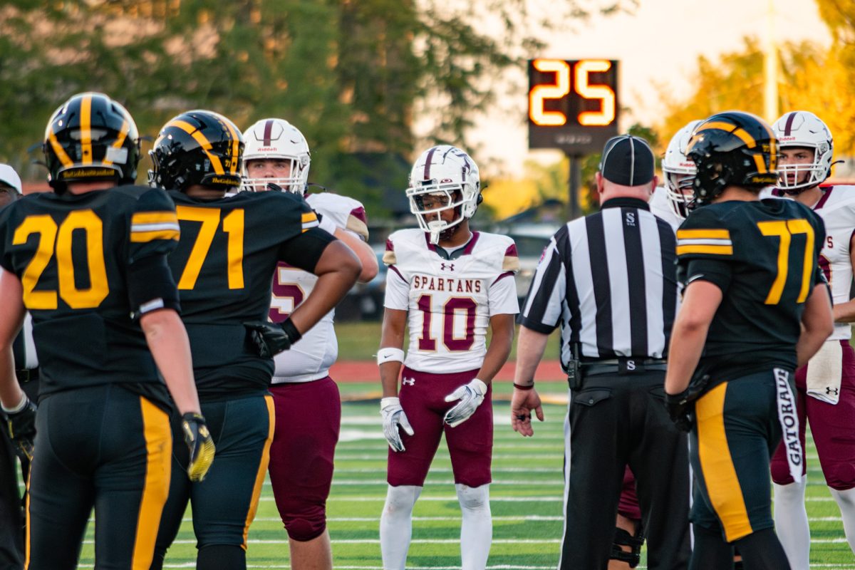 De Smet and Vianney meet for the coin toss prior to kickoff.