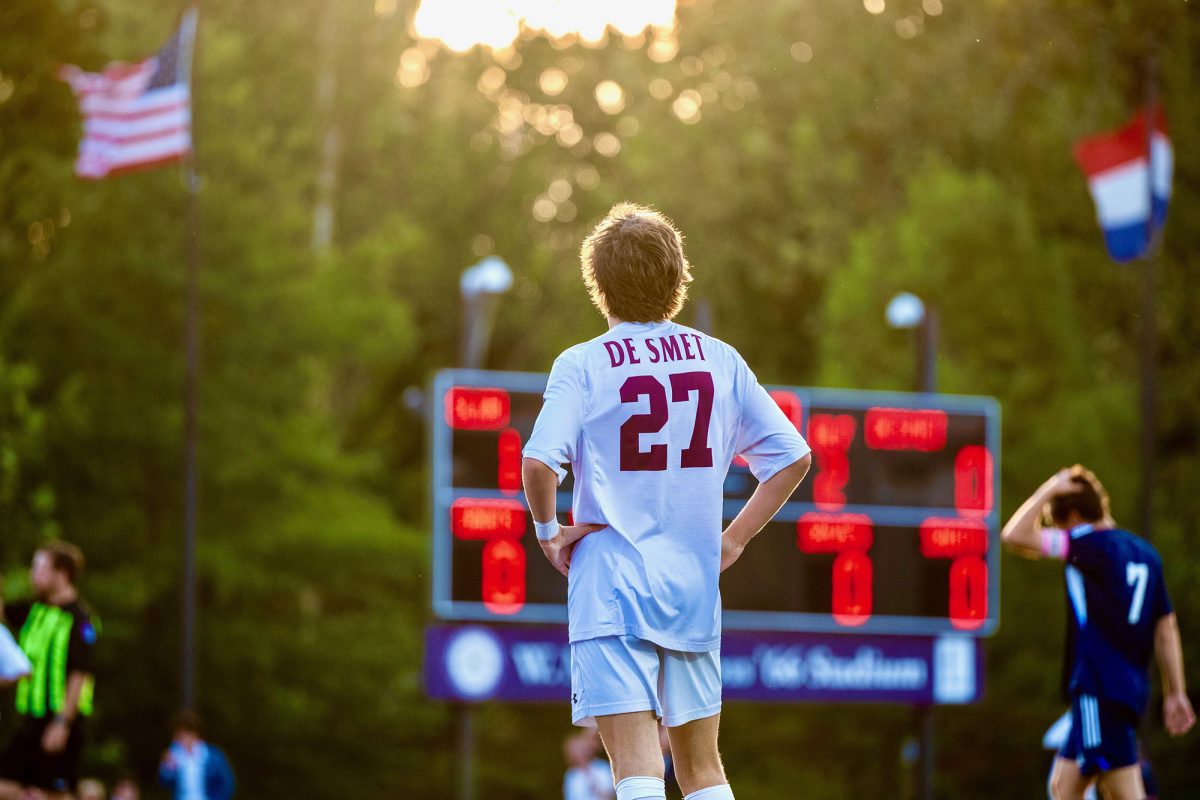 Soccer player looks off into the scoreboard at the Varsity Soccer game vs SLUH. Photo taken by James Hadican ‘29.