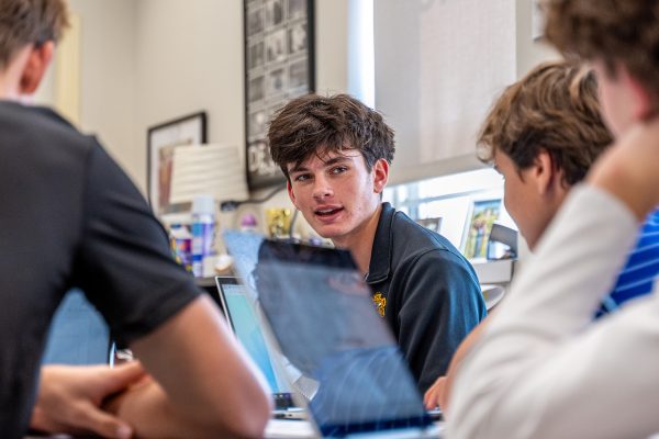 Student talks with friends in group project during Honors English class. Photo taken by Aidan Medley ‘26.