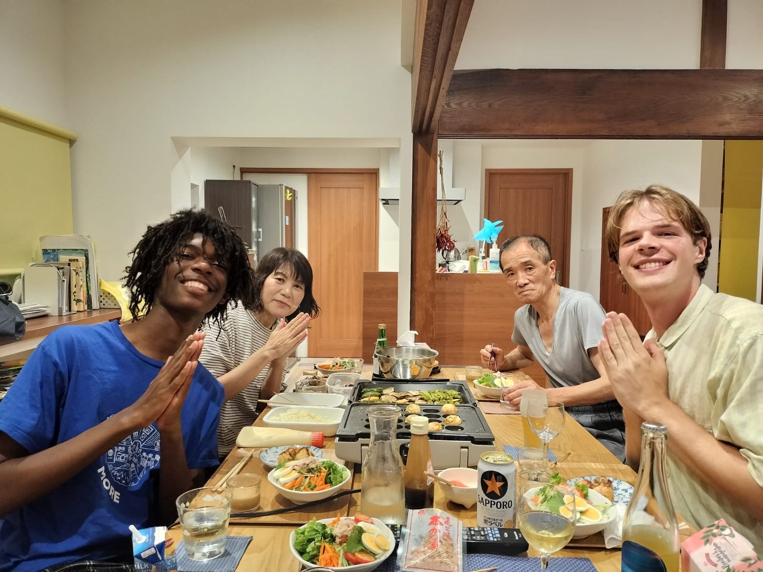 Kyran eating a meal with his host family. Photo courtesy of Kyran Joshway.